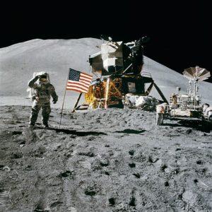 Irwin, the American Flag, the Lunar Rover, and the LM Falcon in the rear, at Hadley Rille